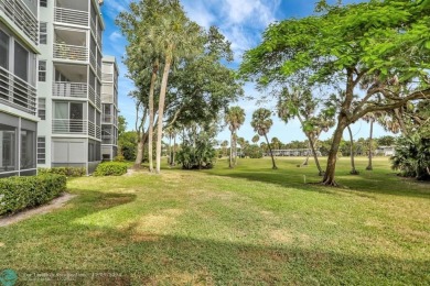 Resort style living in the Grove at Palm Aire!  This well-lit on  in Florida - for sale on GolfHomes.com, golf home, golf lot