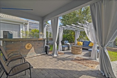 FULL GOLF & TENNIS MEMBERSHP INCLUDED.  Step into luxury living on The Oasis Club at Champions Gate in Florida - for sale on GolfHomes.com, golf home, golf lot