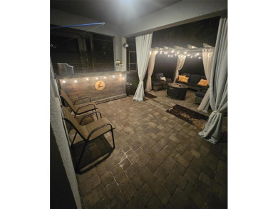 FULL GOLF & TENNIS MEMBERSHP INCLUDED.  Step into luxury living on The Oasis Club at Champions Gate in Florida - for sale on GolfHomes.com, golf home, golf lot