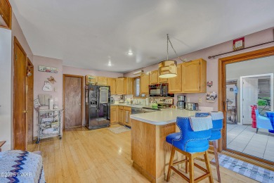 Chalet-Style Retreat in The Hideout This 4-Bedroom, 3-Bath on The Hideout Golf in Pennsylvania - for sale on GolfHomes.com, golf home, golf lot