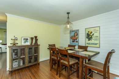 This home sits nestled in a wooded setting and water vista view on Inverness Country Club in Alabama - for sale on GolfHomes.com, golf home, golf lot