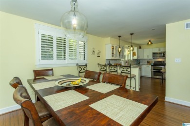 This home sits nestled in a wooded setting and water vista view on Inverness Country Club in Alabama - for sale on GolfHomes.com, golf home, golf lot