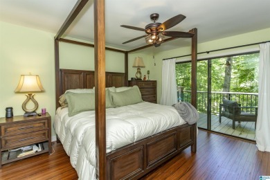 This home sits nestled in a wooded setting and water vista view on Inverness Country Club in Alabama - for sale on GolfHomes.com, golf home, golf lot
