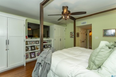 This home sits nestled in a wooded setting and water vista view on Inverness Country Club in Alabama - for sale on GolfHomes.com, golf home, golf lot