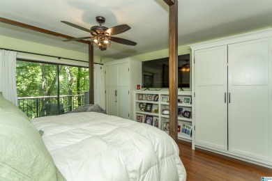 This home sits nestled in a wooded setting and water vista view on Inverness Country Club in Alabama - for sale on GolfHomes.com, golf home, golf lot