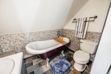 This updated 4-bedroom, 3-bath home is tucked into the Bent Tree on Bent Tree Golf Course in Georgia - for sale on GolfHomes.com, golf home, golf lot