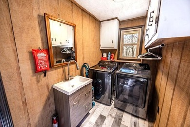 This updated 4-bedroom, 3-bath home is tucked into the Bent Tree on Bent Tree Golf Course in Georgia - for sale on GolfHomes.com, golf home, golf lot