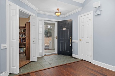 Set along the 13th green in The River subdivision of Lake Royale on River Golf and Country Club at Lake Royale in North Carolina - for sale on GolfHomes.com, golf home, golf lot