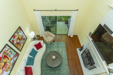This home sits nestled in a wooded setting and water vista view on Inverness Country Club in Alabama - for sale on GolfHomes.com, golf home, golf lot