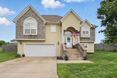 Welcome to 702 Copper Oaks Drive, a stunning 4-bedroom, 3-bath on Briarbrook Golf Course in Missouri - for sale on GolfHomes.com, golf home, golf lot