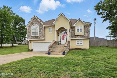 Welcome to 702 Copper Oaks Drive, a stunning 4-bedroom, 3-bath on Briarbrook Golf Course in Missouri - for sale on GolfHomes.com, golf home, golf lot
