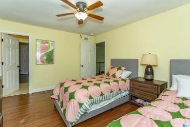 This home sits nestled in a wooded setting and water vista view on Inverness Country Club in Alabama - for sale on GolfHomes.com, golf home, golf lot