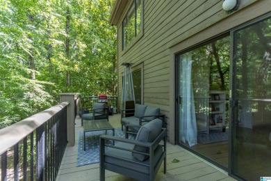 This home sits nestled in a wooded setting and water vista view on Inverness Country Club in Alabama - for sale on GolfHomes.com, golf home, golf lot