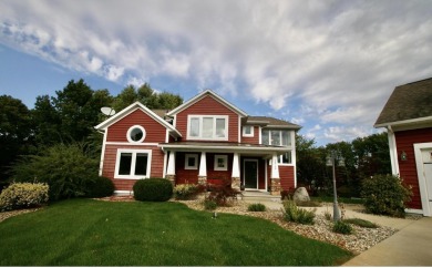 Welcome to ''The Red House'' situated on Grandview Isle, an on Island Hills Golf Club in Michigan - for sale on GolfHomes.com, golf home, golf lot