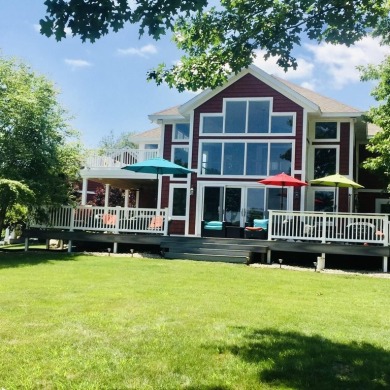 Welcome to ''The Red House'' situated on Grandview Isle, an on Island Hills Golf Club in Michigan - for sale on GolfHomes.com, golf home, golf lot