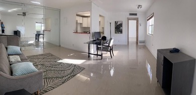 Enjoy tranquil lakeview living in this beautifully updated on Kings Point Golf - Executive in Florida - for sale on GolfHomes.com, golf home, golf lot