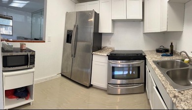 Enjoy tranquil lakeview living in this beautifully updated on Kings Point Golf - Executive in Florida - for sale on GolfHomes.com, golf home, golf lot