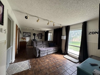 This thoughtfully designed home boasts three generously sized on Riverton Country Club in Wyoming - for sale on GolfHomes.com, golf home, golf lot