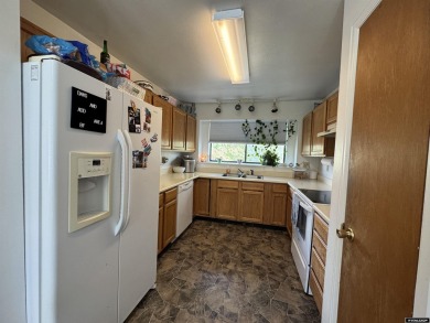 This thoughtfully designed home boasts three generously sized on Riverton Country Club in Wyoming - for sale on GolfHomes.com, golf home, golf lot