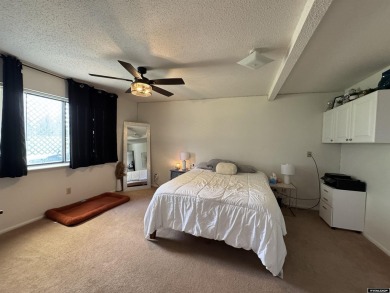 This thoughtfully designed home boasts three generously sized on Riverton Country Club in Wyoming - for sale on GolfHomes.com, golf home, golf lot