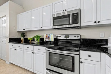 An elegant single-story Mediterranean-style pool home on TPC Eagle Trace in Florida - for sale on GolfHomes.com, golf home, golf lot