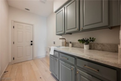 Nestled in a prestigious guard-gated community, this stunning on TPC Las Vegas in Nevada - for sale on GolfHomes.com, golf home, golf lot