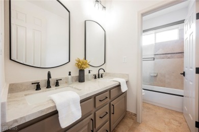 Nestled in a prestigious guard-gated community, this stunning on TPC Las Vegas in Nevada - for sale on GolfHomes.com, golf home, golf lot