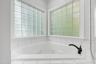 Welcome to this spacious and beautifully maintained 4-bedroom on Magnolia Greens Golf Plantation in North Carolina - for sale on GolfHomes.com, golf home, golf lot