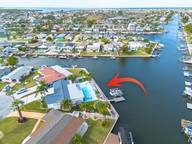 Resort-style living all year round! Waterfront home with Gulf of on Gulf Harbors Golf Course in Florida - for sale on GolfHomes.com, golf home, golf lot