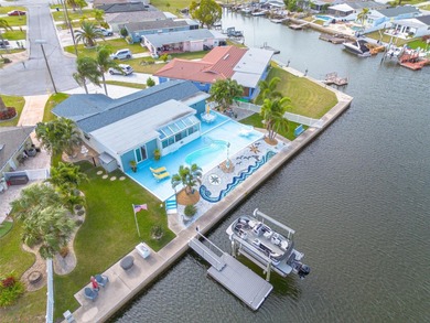 Resort-style living all year round! Waterfront home with Gulf of on Gulf Harbors Golf Course in Florida - for sale on GolfHomes.com, golf home, golf lot