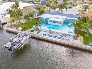 Resort-style living all year round! Waterfront home with Gulf of on Gulf Harbors Golf Course in Florida - for sale on GolfHomes.com, golf home, golf lot