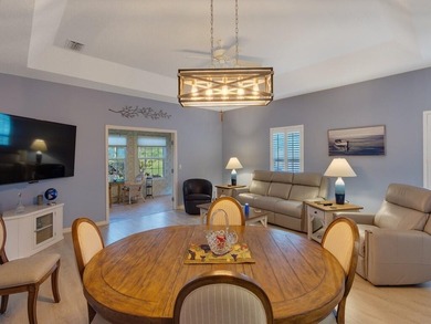 Located on the 5th tee at Gator Trace CC, this beautiful villa on Gator Trace Golf and Country Club in Florida - for sale on GolfHomes.com, golf home, golf lot