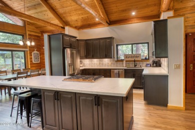 Beautifully renovated real log cabin on the fairway at Pinetop on Pinetop Lakes Country Club in Arizona - for sale on GolfHomes.com, golf home, golf lot