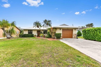 New Metal Roof! New AC! New Impact Windows! Pool! This home has on Atlantis Golf Club in Florida - for sale on GolfHomes.com, golf home, golf lot