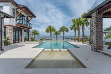 Pristinely poised on the coveted west-facing shores of Driftwood on Sandestin Golf and Beach Resort - Raven in Florida - for sale on GolfHomes.com, golf home, golf lot