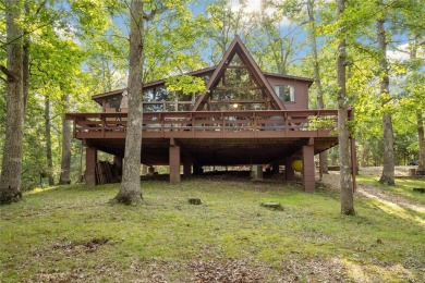 Nestled on a serene 2-acre lot at, this delightful A-frame home on Innsbrook Resort Golf Course in Missouri - for sale on GolfHomes.com, golf home, golf lot