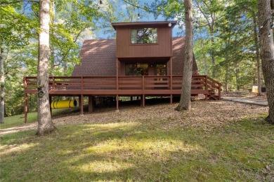 Nestled on a serene 2-acre lot at, this delightful A-frame home on Innsbrook Resort Golf Course in Missouri - for sale on GolfHomes.com, golf home, golf lot