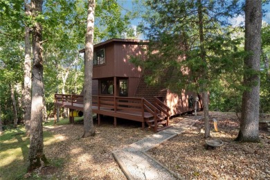 Nestled on a serene 2-acre lot at, this delightful A-frame home on Innsbrook Resort Golf Course in Missouri - for sale on GolfHomes.com, golf home, golf lot