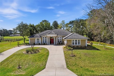 Nestled beneath a canopy of mature oaks on a lush, expansive lot on Citrus Hills Golf Club in Florida - for sale on GolfHomes.com, golf home, golf lot