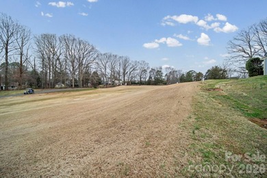 Discover low-maintenance living within the highly desirable on Raintree Country Club in North Carolina - for sale on GolfHomes.com, golf home, golf lot
