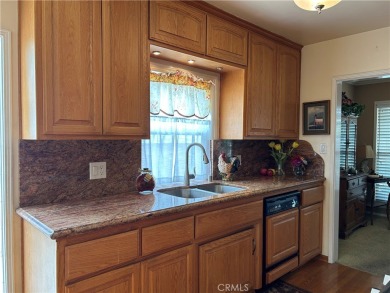 This single-story home situated in South of Conant neighborhood on Skylinks At Long Beach Golf Course in California - for sale on GolfHomes.com, golf home, golf lot