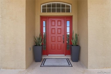 Nestled beneath a canopy of mature oaks on a lush, expansive lot on Citrus Hills Golf Club in Florida - for sale on GolfHomes.com, golf home, golf lot