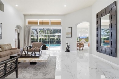 Nestled beneath a canopy of mature oaks on a lush, expansive lot on Citrus Hills Golf Club in Florida - for sale on GolfHomes.com, golf home, golf lot