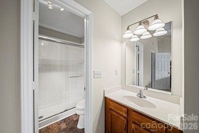 Discover low-maintenance living within the highly desirable on Raintree Country Club in North Carolina - for sale on GolfHomes.com, golf home, golf lot