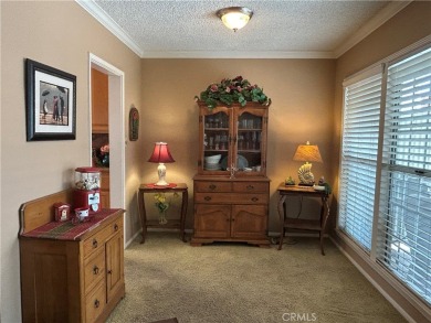 This single-story home situated in South of Conant neighborhood on Skylinks At Long Beach Golf Course in California - for sale on GolfHomes.com, golf home, golf lot