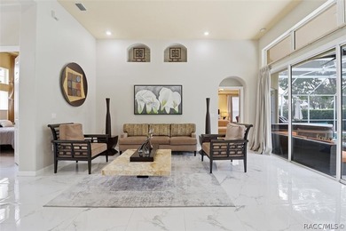 Nestled beneath a canopy of mature oaks on a lush, expansive lot on Citrus Hills Golf Club in Florida - for sale on GolfHomes.com, golf home, golf lot