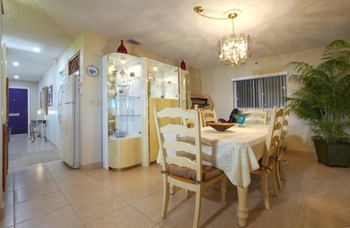 Welcome home to this well-maintained 2-bedroom, 2 bath CBS home on Leisureville Community Golf Course in Florida - for sale on GolfHomes.com, golf home, golf lot