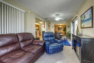Welcome home to this well-maintained 2-bedroom, 2 bath CBS home on Leisureville Community Golf Course in Florida - for sale on GolfHomes.com, golf home, golf lot