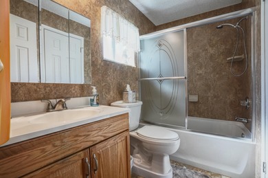 Welcome home to this well-maintained 2-bedroom, 2 bath CBS home on Leisureville Community Golf Course in Florida - for sale on GolfHomes.com, golf home, golf lot