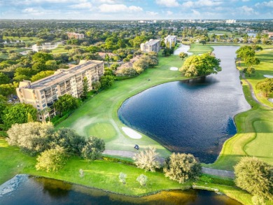 Remodeled apartment with stunning golf course and lake views! on Grande Oaks Golf Club in Florida - for sale on GolfHomes.com, golf home, golf lot